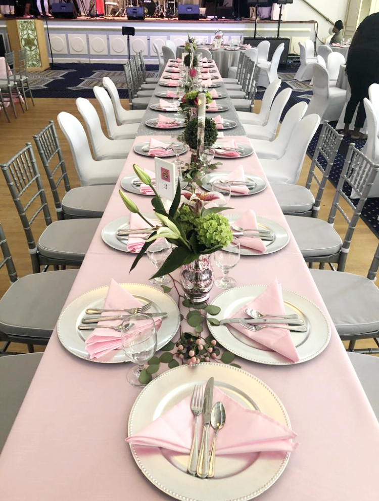 Wedding reception long pink table with green floral arrangements eccessories by ellen www.eccessoriesbyellen.com