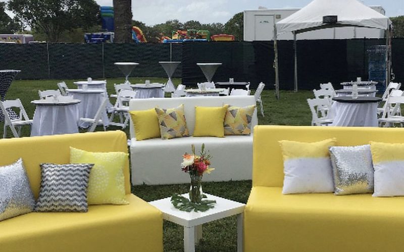yellow and white corporate lounge chairs with white tables eccessories by ellen www.eccessoriesbyellen.com