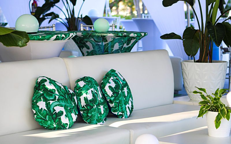 An event white lounge chairs with green and white pillows and décor. Accessories and arrangements - eccessories by ellen www.eccessoriesbyellen.com